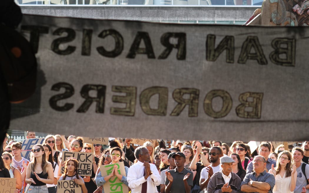 A large crowd gathered in Aotea Square last night to protest Donald Trump's presidency and to support the Muslim community.