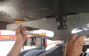 Checking for skid plate distortion.