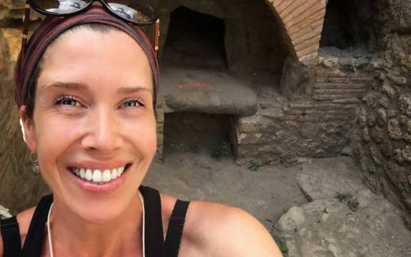 Farrell Monaco Studying a Bread Oven at Pompeii. Photo by Maureen Doyle.
