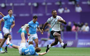 Fiji’s Iowane Teba breaks through the Uruguay defense for a try on day one of the Paris 2024 Olympic Games at Stade de France on 24 July, 2024 in Paris. Photo credit: Mike Lee - KLC fotos for World Rugby