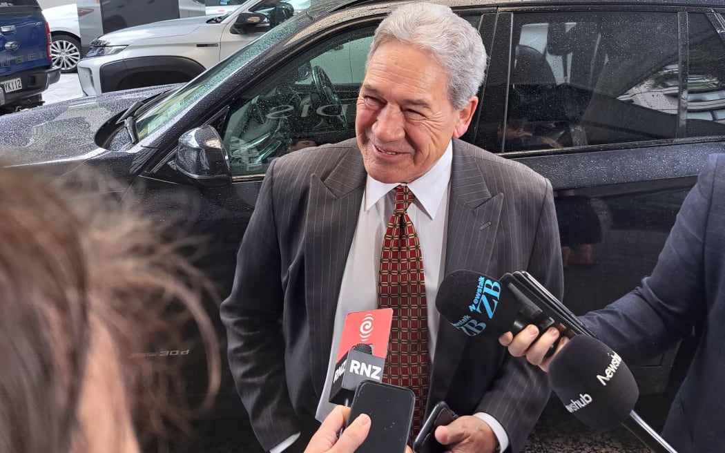 Winston Peters arrives at an Auckland hotel for further talks with the National Party.