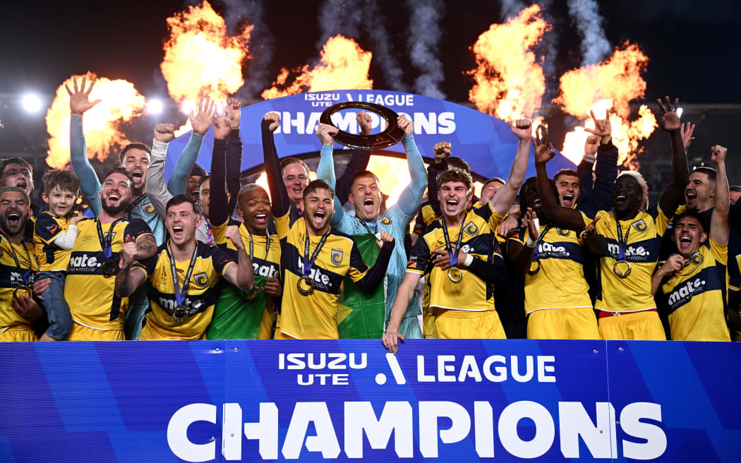 Danny Vukovic (centre) and Mariners teammtes celebrate winning the A-League Men Grand Final 2024.