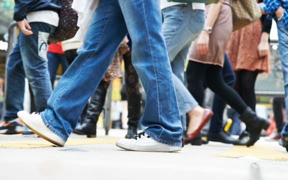 Pedestrians crossing a street. Urban rush hour