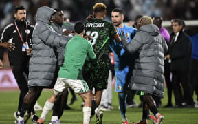 Nigeria's midfielder #18 Raphael Onyedika, Algeria's goalkeeper #23 Luca Zidane and players argue during the Africa Cup of Nations (CAN) quarter-final football match between Algeria and Nigeria at the Grand stadium in Marrakesh on January 10, 2026. (Photo by Paul ELLIS / AFP)