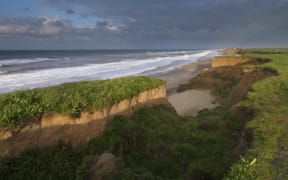 The heavily eroded cliffs at Happisburgh, Norfolk, England, United Kingdom, Europe (Photo by Jon Gibbs / Robert Harding Premium / robertharding via AFP)