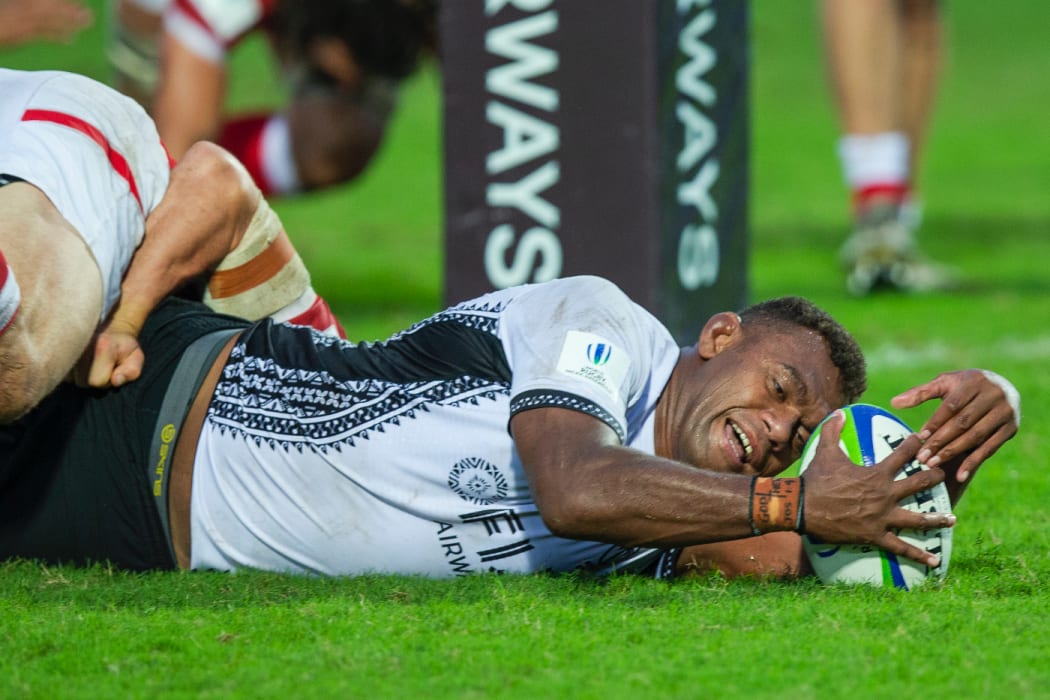 Fiji captain Leone Nakarawa stretches out to score against Canada