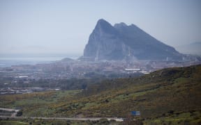 The Gibraltar Rock is pictured from La Linea de la Concepcion near ther southern Spanish city of Cadiz on March 28, 2017.