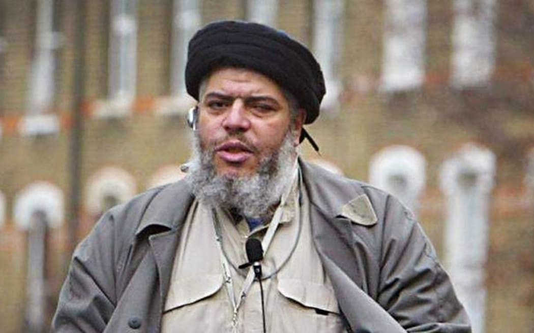 Abu Hamza al-Masri addresses followers during Friday prayer near Finsbury Park in north London on 26 March 2004.