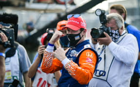 Scott Dixon wearing a mask along with media after his claiming his sixth series crown on 26 October, 2020.
