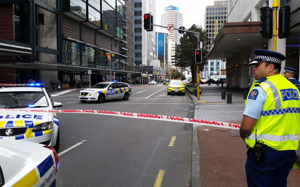 Police at the scene of a fall from a building on Auckland's Albert Street.
