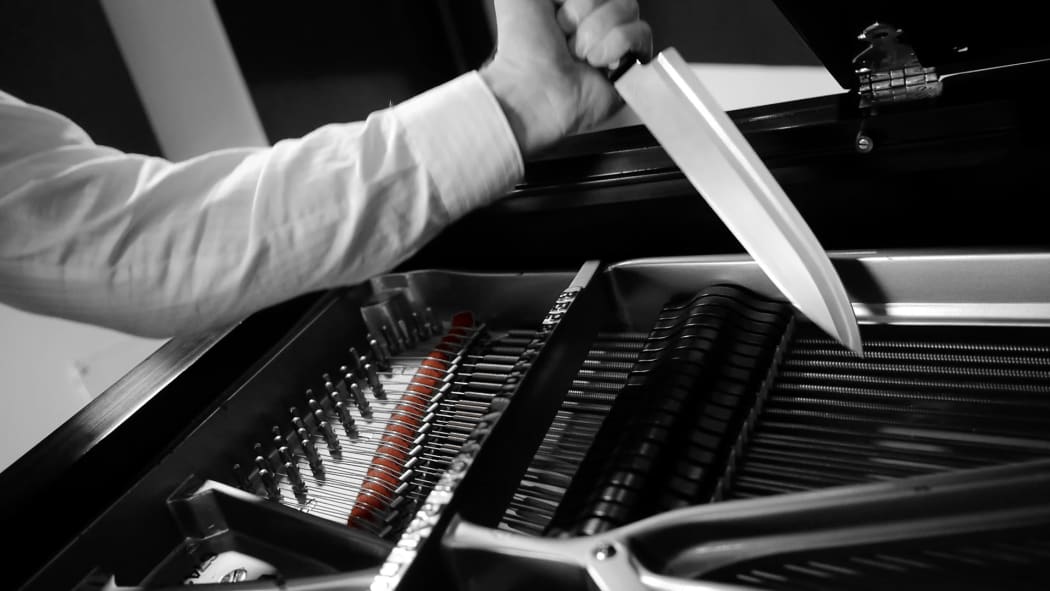 Joachim Horsley plays the piano with knives