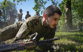 Newly recruited soldiers of the 3rd assault brigade train in Kyiv, Ukraine, Friday, May 17, 2024. A divisive mobilisation law in Ukraine came into force on Saturday, as Kyiv struggles to boost troop numbers after Russia launched a new offensive.