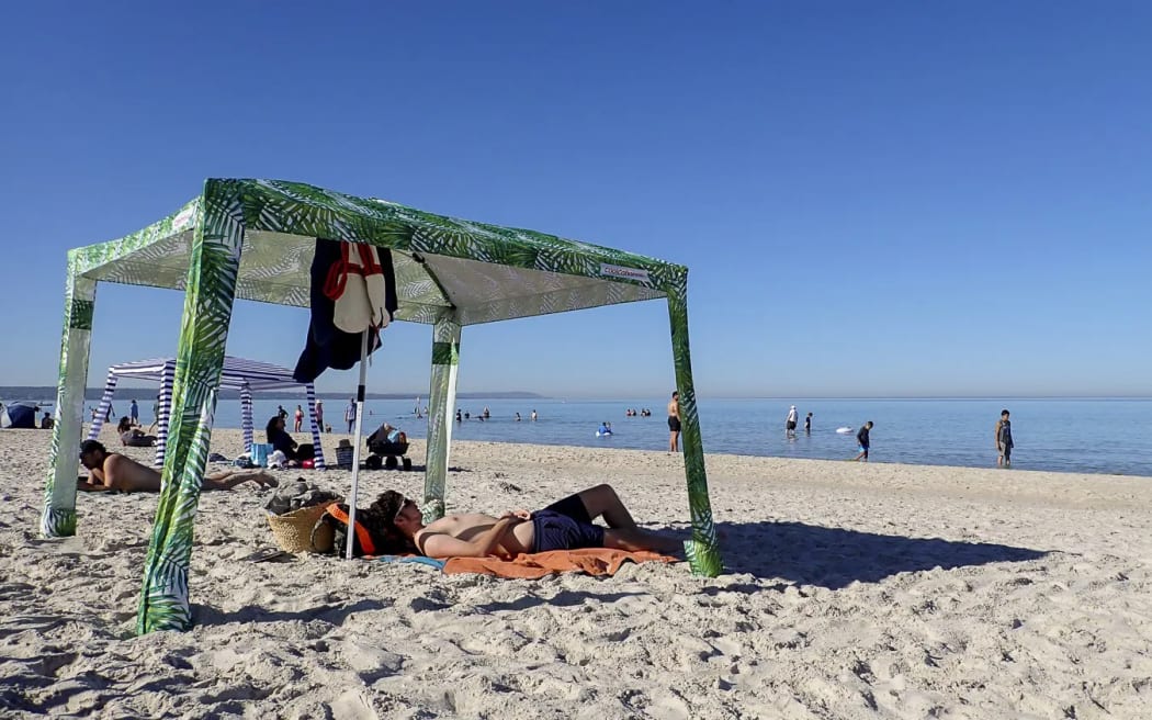 Beachgoers were out to beat the heat at Carrum Beach in Melbourne's south.