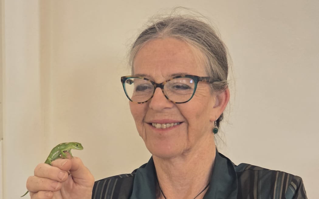 Celia Wade-Brown with a Wellington green gecko on her hand