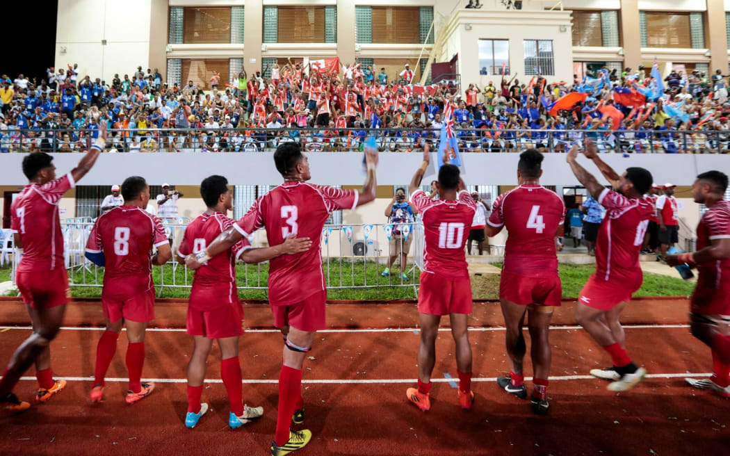 Tonga celebrate their bronze medal and qualification for Rugby World Cup Sevens.