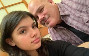 Candian tourist Piper James, pictured with her father Todd, has been named as the person found on K'gari surrounded by a pack of dingoes.