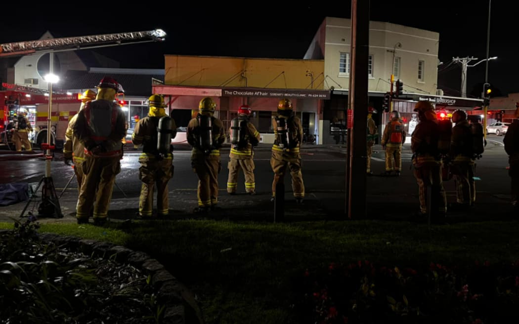 Smoke and a red glow was seen rising over Onehunga after a commercial building caught fire on 26 May, 2024.
