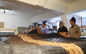 Ngatu is made from the inner bark of the mulberry tree (hiapo), which is stripped from the stem and beaten with a mallet to create the fabric. October 2024