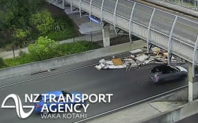 Debris blocks lanes on Southern Motorway in Auckland.