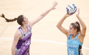 Steel shooter Te Huinga Reo Selby-Rickit shoots over Stars defender Kate Burley
