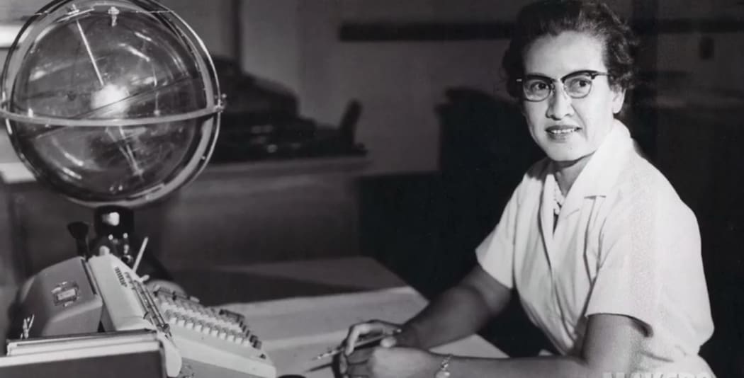 NASA file handout photo shows NASA research mathematician Katherine Johnson at her desk at Langley Research Center.