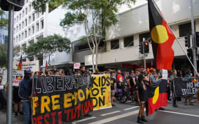 Hundreds attended the rally in Brisbane on Saturday.