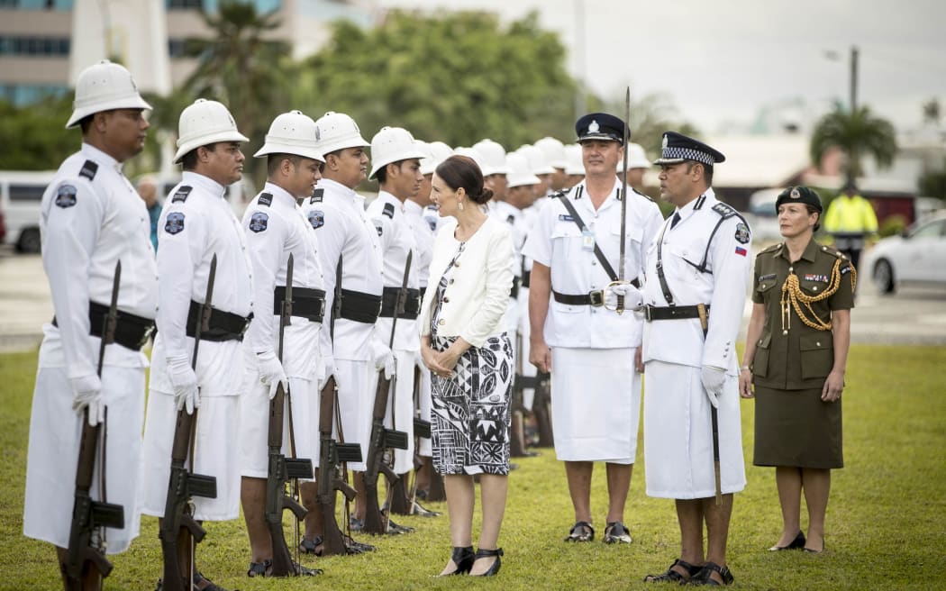 Jacinda Ardern inspects the Guard of Honour in Samoa.