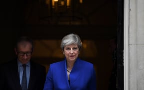 Theresa May leaves 10 Downing Street, en route to Buckingham Palace to meet the Queen the day after the general election.