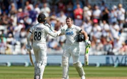 Tom Latham of New Zealand celebrates with batting partner Devon Conway after reaching his 100. Trent Bridge, 2026.