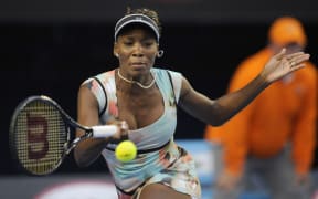 18.01.2013 Melbourne, Australia. Venus Williams returns a shot in her match on day five of the Australian Open from Melbourne Park.