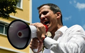 Venezuelan opposition leader and self-proclaimed acting president Juan Guaido speaks during a demo in Caracas on March 9, 2019.