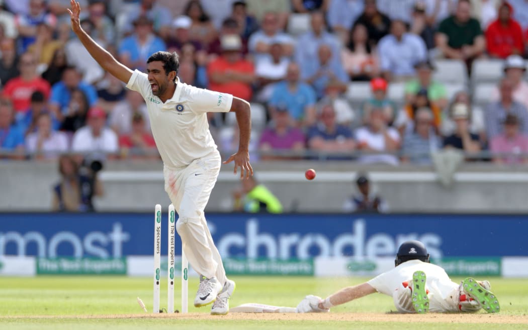 Indian bowler Ravi Ashwin celebrates the run out of England captain Joe Root.