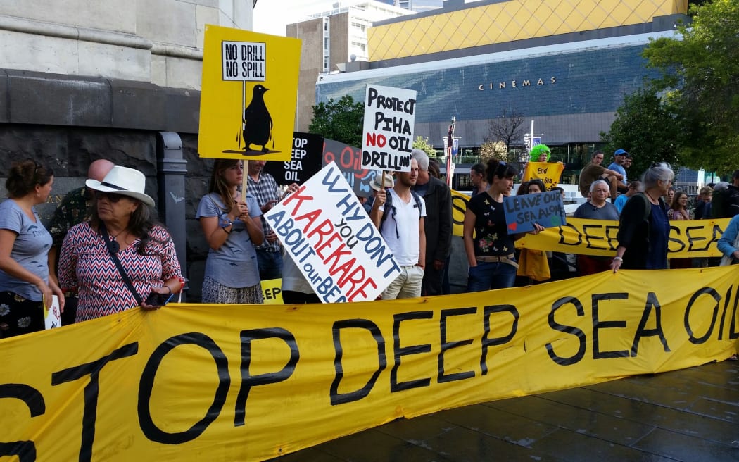 Protestors meet councilors at Auckland town hall.