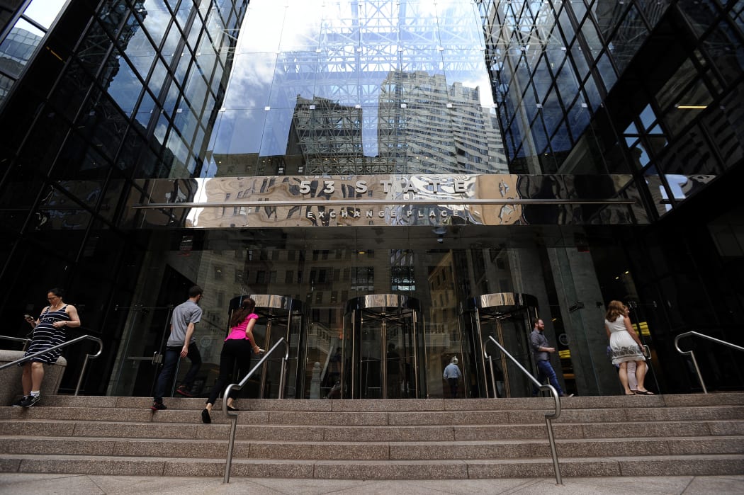 People enter and exit the Boston Globe building, 15 August 2018.
