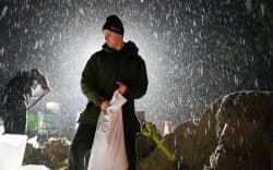 A team of volunteers has been filling sandbags for hours at Dunedin Ice Stadium.