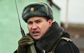 An officer talks on the radio during the military drills held by Russia's Southern Military District at the Kadamovsky training ground, in Rostov region, Russia.