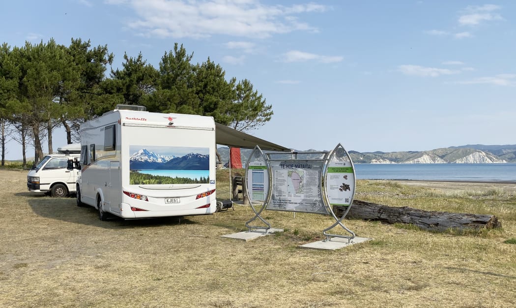 Holidaymakers camp out at the beach front.