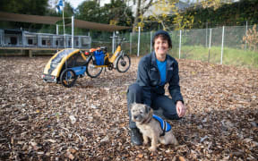 Biosecurity advisor & dog handler Lois Clayton pcitured with Kosher infront of the Council's electric bike and trailer setup.
