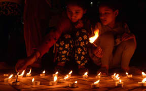 Nepalese residents gather in Durbar Square in Kathmandu to mark the first anniversary of the devastating earthquake.