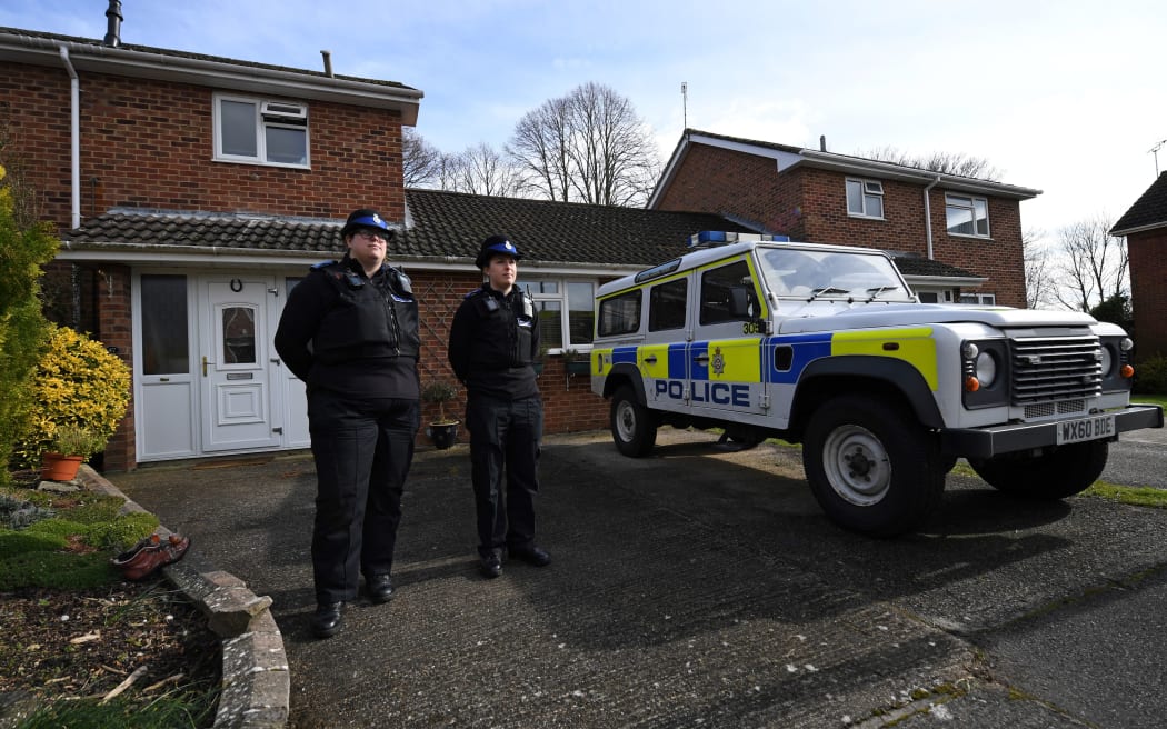 Police stand on duty outside a residential property in Salisbury, believed to have been cordonned off in connection with the major incident that left former Russian double agent Sergei Skripal fighting for his life.