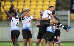 Fiji celebrate the final whistle after beating New Zealand.