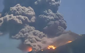 This handout photo taken on February 26, 2026 courtesy of the Facebook page of Ethan Asentista shows the eruption of Kanlaon volcano as seen from Canlaon City, Negros Oriental province in the central Philippines.