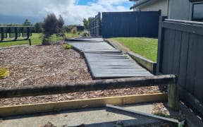 Fences and trees are down today in the Summerhill area of Palmerston North after a windy night.