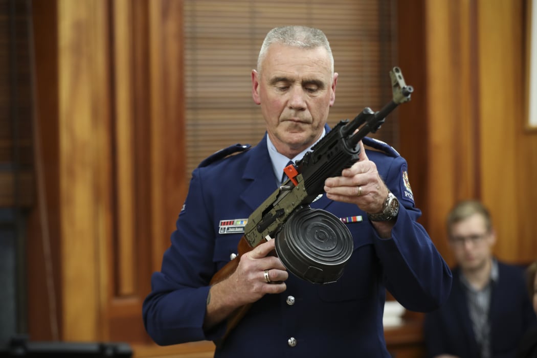Police officer Paddy Hennan demostrates illegal gun modifications