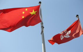 China national flag and Hong Kong flag wave in Hong Kong on Oct 10, 2020.