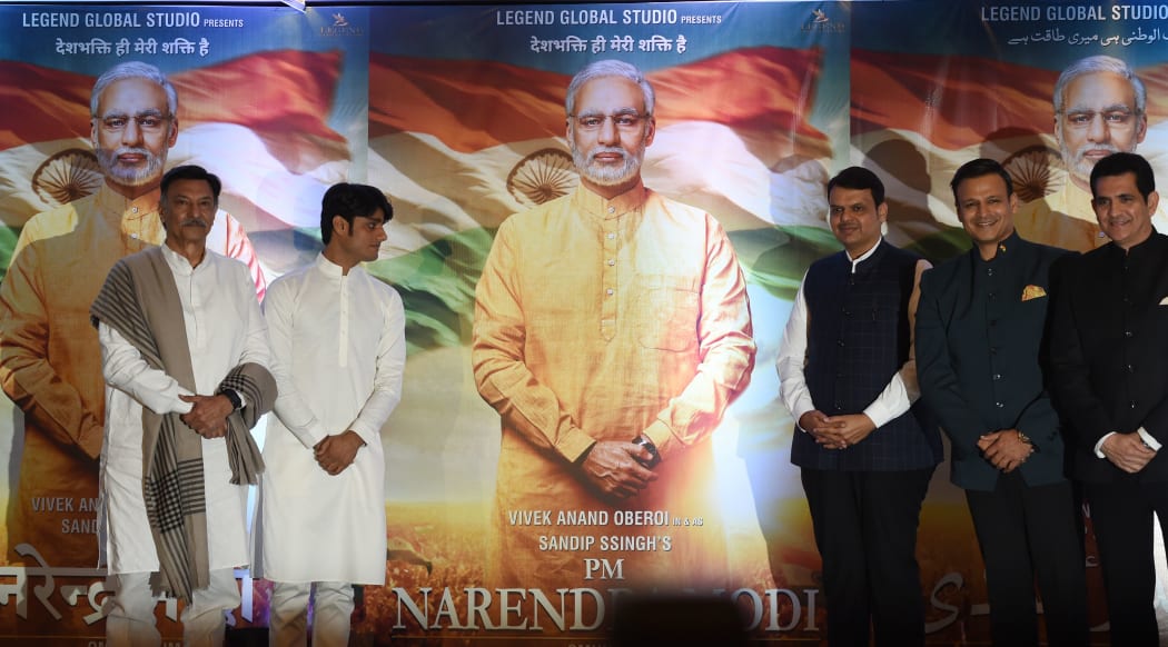 Actors and directors pose with posters of the upcoming Bollywood film  "PM Narendra Modi" - a biopic on Indian Prime Minister Narendra Modi. Actor Vivek Oberoi (2R) portrays the Indian Prime Minister in the film.