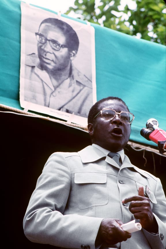 Zimbabwean Prime Minister and leader of the ZANU party, Robert Mugabe, gives a speech after the party won the general election, in March 1980 in Harare.