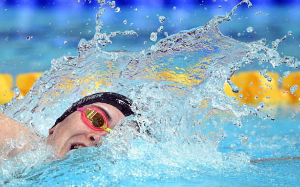 New Zealand’s Erika Fairweather competes in the women’s 400m Freestyle final during the swimming event at the Tollcross International Swimming Centre in Glasgow, on day one of the Commonwealth Games in Glasgow, Scotland, on July 24, 2026. (Photo by Oli SCARFF / AFP)