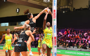 Jamaica's Jhaniele Fowler scores against New Zealand's Karin Burger during their bronze medal play-off in the Netball World Cup in Cape Town on 06 August 2023.