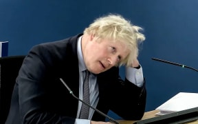A video grab from footage broadcast by the UK Covid-19 Inquiry shows Britain's former Prime Minister Boris Johnson speaking at the UK Covid-19 Inquiry, in west London, on December 6, 2023 to give evidence. Former UK prime minister Boris Johnson will face tough questioning at a public inquiry on December 6, 2023 over his government's handling of the Covid-19 pandemic, after a barrage of criticism from his former aides. Johnson, who has been accused of indecisiveness and a lack of scientific understanding, is expected to admit that he "unquestionably made mistakes" during two days of grilling in London. (Photo by UK Covid-19 Inquiry / AFP) / XGTY / RESTRICTED TO EDITORIAL USE - MANDATORY CREDIT "AFP PHOTO / UK Covid-19 Inquiry " - NO MARKETING - NO ADVERTISING CAMPAIGNS - DISTRIBUTED AS A SERVICE TO CLIENTS
